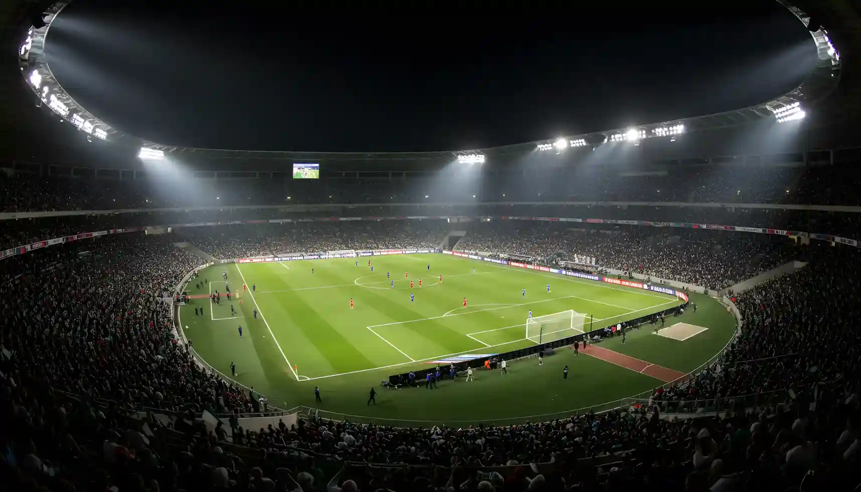 Partido de fútbol nocturno en un gran estadio con aficionados en las gradas