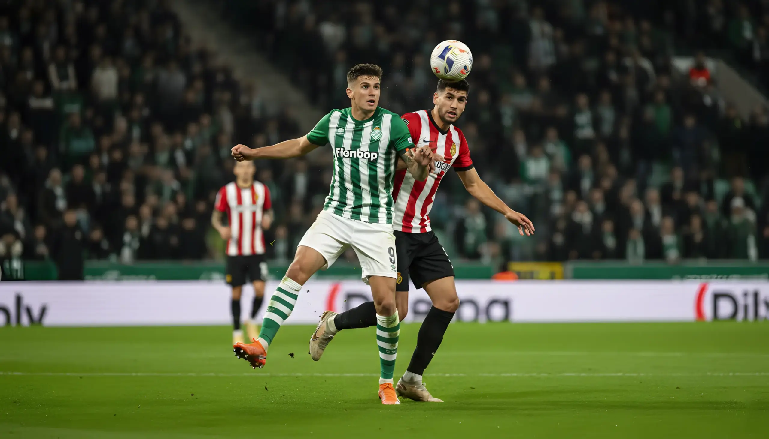 Jugadores de fútbol en acción durante un partido nocturno en estadio rival